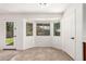 Bright dining area with bay windows, tile floors, and backyard access at 37911 N Luke Ln, San Tan Valley, AZ 85140