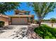 Charming two-story home with a two-car garage and well-maintained landscaping on a sunny day at 37911 N Luke Ln, San Tan Valley, AZ 85140