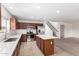 Bright kitchen with stainless appliances, tile floors, and a convenient center island at 37911 N Luke Ln, San Tan Valley, AZ 85140
