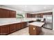 Modern kitchen featuring stainless steel appliances, granite countertops, and a center island at 37911 N Luke Ln, San Tan Valley, AZ 85140