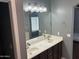 Bathroom with double sinks, framed mirror and decorative vanity lighting at 38242 N Armadillo Dr, San Tan Valley, AZ 85140