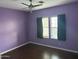 Bright bedroom with a ceiling fan and window providing natural light at 38242 N Armadillo Dr, San Tan Valley, AZ 85140