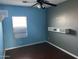Bedroom featuring a modern ceiling fan and shelf, offering both style and functionality at 38242 N Armadillo Dr, San Tan Valley, AZ 85140