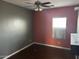 Vacant bedroom with hardwood floors, neutral walls, and a window at 38242 N Armadillo Dr, San Tan Valley, AZ 85140