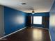 Bonus room with plenty of space, ceiling fan, and built-in storage at 38242 N Armadillo Dr, San Tan Valley, AZ 85140