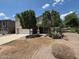 Two-story home featuring a two-car garage and desert landscaping under a beautiful blue sky at 38242 N Armadillo Dr, San Tan Valley, AZ 85140