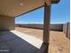 Inviting covered patio area looking out to a spacious backyard with privacy block wall, ready for customization at 3845 N Camden Dr, Florence, AZ 85132