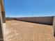 Spacious backyard featuring a block wall, offering endless possibilities for outdoor living at 3845 N Camden Dr, Florence, AZ 85132