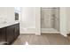 Bathroom featuring a bathtub, shower with glass door and modern vanity at 3845 N Camden Dr, Florence, AZ 85132