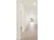 Bright hallway featuring tile flooring and neutral walls leading to the living area at 3845 N Camden Dr, Florence, AZ 85132