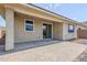 Beautiful backyard showcasing a covered patio and well-maintained landscaping at 41279 W Elm Dr, Maricopa, AZ 85138