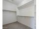 Walk-in closet with ample shelving and space for organization at 41279 W Elm Dr, Maricopa, AZ 85138