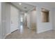 Bright and airy foyer with tile flooring and neutral paint at 41279 W Elm Dr, Maricopa, AZ 85138