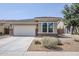 Charming single-story home featuring a two-car garage and low maintenance desert landscaping at 41279 W Elm Dr, Maricopa, AZ 85138