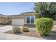 Charming single-story home with desert landscaping and tree in the front yard at 41279 W Elm Dr, Maricopa, AZ 85138