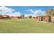 Spacious grassy lawn with barbecue and picnic area, perfect for outdoor gatherings and community events at 41279 W Elm Dr, Maricopa, AZ 85138