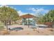 Community playground features a shaded play structure with slides, climbing areas and lots of space for fun activity at 41279 W Elm Dr, Maricopa, AZ 85138