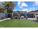 Spacious backyard featuring a pergola with outdoor seating and green turf at 4136 E Eugie Ave, Phoenix, AZ 85032