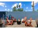 Cozy backyard retreat with fire pit and comfortable Adirondack chairs for outdoor relaxation at 4136 E Eugie Ave, Phoenix, AZ 85032