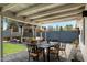 Inviting backyard with patio seating and a pergola, perfect for entertaining at 4136 E Eugie Ave, Phoenix, AZ 85032
