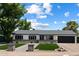 Charming single-story home with well-manicured lawn and welcoming curb appeal at 4136 E Eugie Ave, Phoenix, AZ 85032