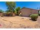 An expansive backyard featuring a potential play area, defined firepit and ample space for recreation at 42458 W Desert Fairways Dr, Maricopa, AZ 85138