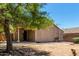 The backyard features a covered patio with a view of the expansive yard at 42458 W Desert Fairways Dr, Maricopa, AZ 85138