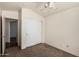 Bedroom featuring a ceiling fan and a closet with sliding doors at 42458 W Desert Fairways Dr, Maricopa, AZ 85138