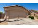 Lovely one-story property boasting attractive landscaping and a practical two-car garage at 42458 W Desert Fairways Dr, Maricopa, AZ 85138