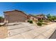 Desirable single-level property with a tidy front yard and a functional two-car garage at 42458 W Desert Fairways Dr, Maricopa, AZ 85138