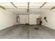 Spacious garage with water heater, storage shelves and high ceilings, ready for your vehicles and projects at 42458 W Desert Fairways Dr, Maricopa, AZ 85138