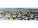 Community aerial view with well-maintained homes, mature landscaping, and scenic mountain backdrop at 4408 W Summerside Rd, Laveen, AZ 85339
