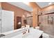 Modern bathroom features a shower with glass doors, granite countertops, and a storage cabinet at 4408 W Summerside Rd, Laveen, AZ 85339