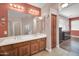 Bathroom featuring a double sink vanity and a large mirror with good lighting at 4408 W Summerside Rd, Laveen, AZ 85339