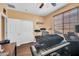 Bedroom with ceiling fan, wood floors, natural light, space for music and play, and closet at 4408 W Summerside Rd, Laveen, AZ 85339