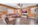 Comfortable living room with a large sectional couch, hardwood floors, and a modern entertainment setup at 4408 W Summerside Rd, Laveen, AZ 85339