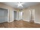 Bedroom with a ceiling fan, closet, ensuite, and wood-look flooring at 4465 E Paradise Village S Pkwy # 1224, Phoenix, AZ 85032