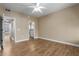 Spacious bedroom with ceiling fan, ensuite bathroom, and wood-look flooring at 4465 E Paradise Village S Pkwy # 1224, Phoenix, AZ 85032
