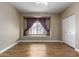 Bedroom with window seat with blinds and a closet for ample storage space at 4465 E Paradise Village S Pkwy # 1224, Phoenix, AZ 85032