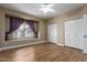Bright bedroom with a large window, ceiling fan, and closet for ample storage space at 4465 E Paradise Village S Pkwy # 1224, Phoenix, AZ 85032