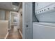 Hallway view with a stacked washer and dryer near the entrance and hallway at 4465 E Paradise Village S Pkwy # 1224, Phoenix, AZ 85032