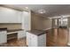 Bright open-concept living room featuring an island, cabinets with countertop, and outdoor access at 4465 E Paradise Village S Pkwy # 1224, Phoenix, AZ 85032