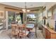 Charming dining area featuring an elegant table setting, natural light, and tranquil views at 4548 E Nightingale Ln, Gilbert, AZ 85298