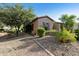 Attractive single-story home with desert landscaping and well-manicured greenery at 4548 E Nightingale Ln, Gilbert, AZ 85298
