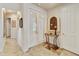 Warm foyer featuring tile floors, decor table, and view to hallway at 4548 E Nightingale Ln, Gilbert, AZ 85298