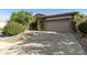 Charming home featuring a two-car garage with a driveway and mature landscaping at 4548 E Nightingale Ln, Gilbert, AZ 85298