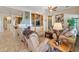 Spacious living room featuring tile flooring and custom built-in shelving at 4548 E Nightingale Ln, Gilbert, AZ 85298