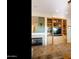 Comfortable living area featuring fireplace, built-ins, and views into dining and living spaces at 4548 E Nightingale Ln, Gilbert, AZ 85298