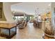 Open-concept living space featuring a fireplace and a view to kitchen and dining areas at 4548 E Nightingale Ln, Gilbert, AZ 85298