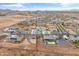 High angle shows the neighborhood's layout, desert scenery, and array of houses, creating a visual landscape at 460 W Chase St, San Tan Valley, AZ 85143